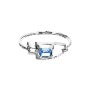 Metal alloy semi rigid bracelet plated in sterling silver with blue faceted crystal
