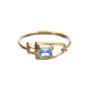 Metal alloy semi rigid bracelet plated in gold 18k with blue faceted crystal